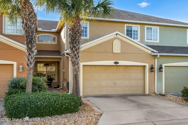 view of front of property with a garage