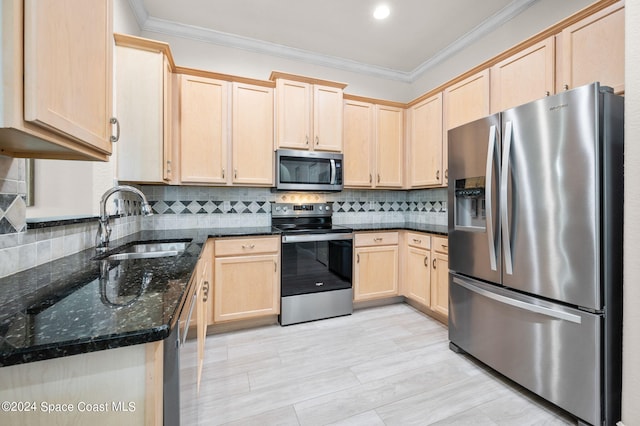 kitchen featuring dark stone counters, sink, light brown cabinetry, appliances with stainless steel finishes, and tasteful backsplash