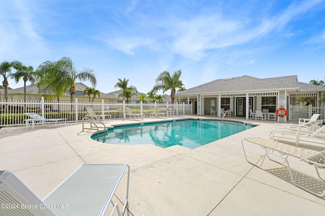 view of swimming pool with a patio