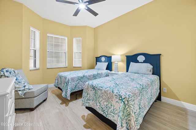 bedroom featuring wood-type flooring and ceiling fan