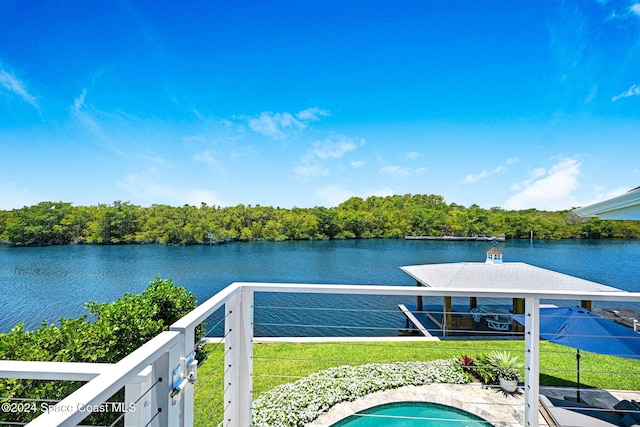 exterior space with a yard and a water view