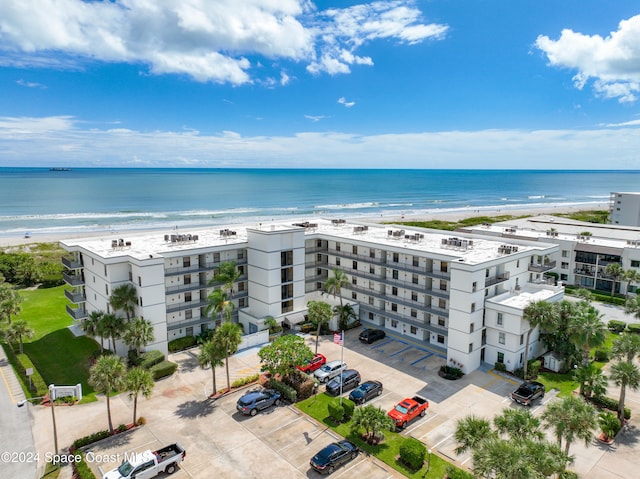 aerial view featuring a view of the beach and a water view