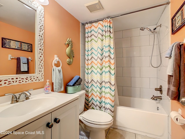 full bathroom featuring tile patterned floors, vanity, toilet, and shower / bath combo with shower curtain