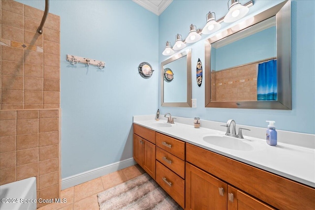 bathroom with crown molding, tile patterned flooring, vanity, and tiled shower / bath combo