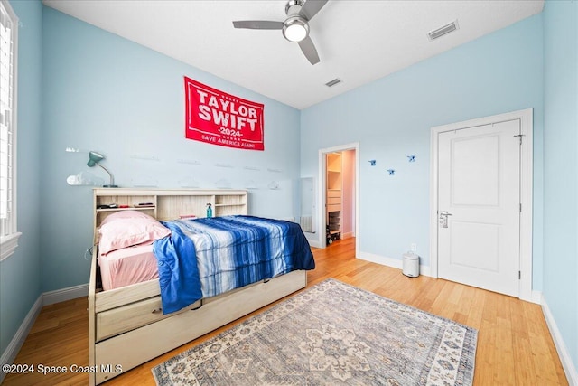 bedroom with hardwood / wood-style floors and ceiling fan