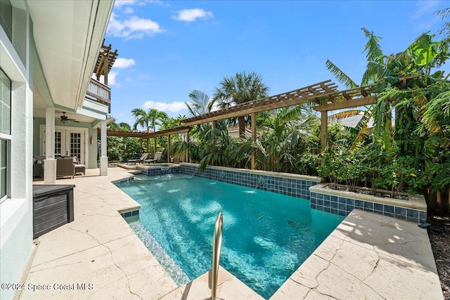 view of pool featuring a pergola, a patio area, ceiling fan, and an outdoor living space