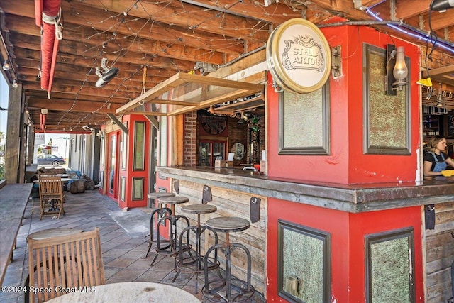 exterior space featuring an outdoor bar