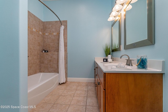 full bathroom featuring shower / bath combination with curtain, vanity, baseboards, and tile patterned floors