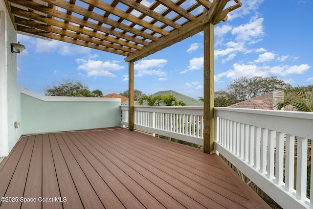 wooden terrace with a pergola