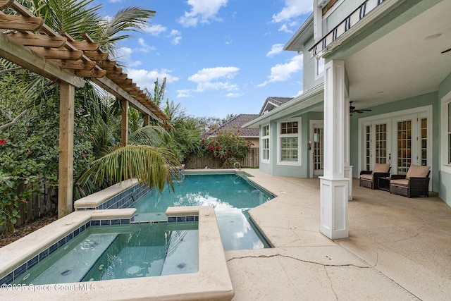 view of swimming pool featuring a fenced backyard, an in ground hot tub, french doors, a pergola, and a patio area