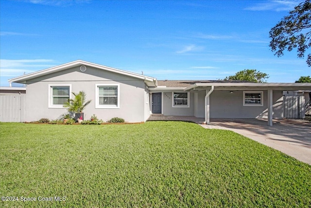 ranch-style home with a front lawn