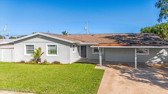 ranch-style house featuring a patio and a front yard