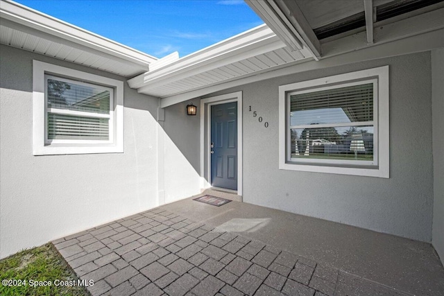 1500 Dorsal St, Merritt Island, FL 32952 - view of exterior entry featuring stucco siding