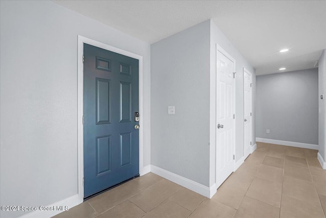 entrance foyer featuring light tile patterned floors