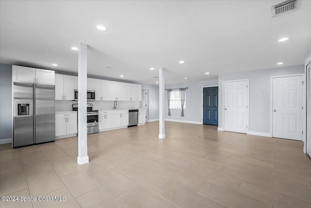 interior space featuring sink and light tile patterned floors