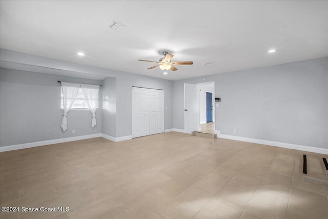 unfurnished bedroom featuring a closet and ceiling fan