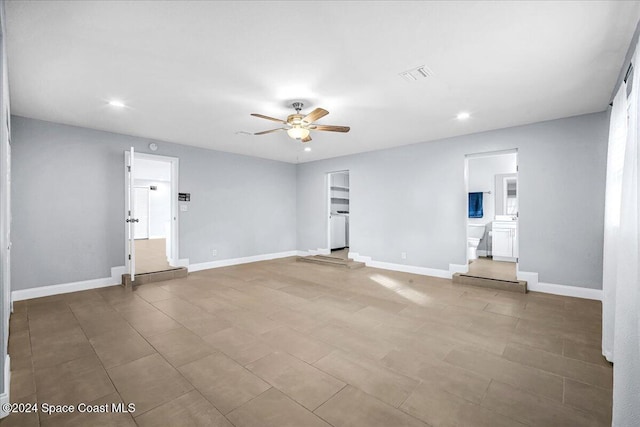1500 Dorsal St, Merritt Island, FL 32952 - unfurnished living room with a ceiling fan, recessed lighting, and baseboards