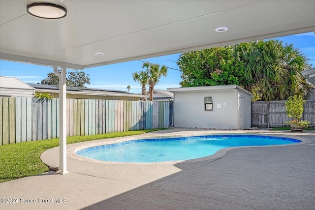 1500 Dorsal St, Merritt Island, FL 32952 - view of pool featuring a fenced backyard, a patio, and an outdoor structure