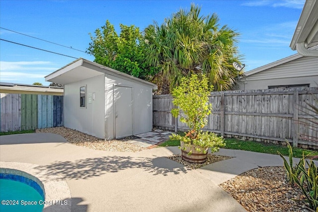 view of patio / terrace with a shed