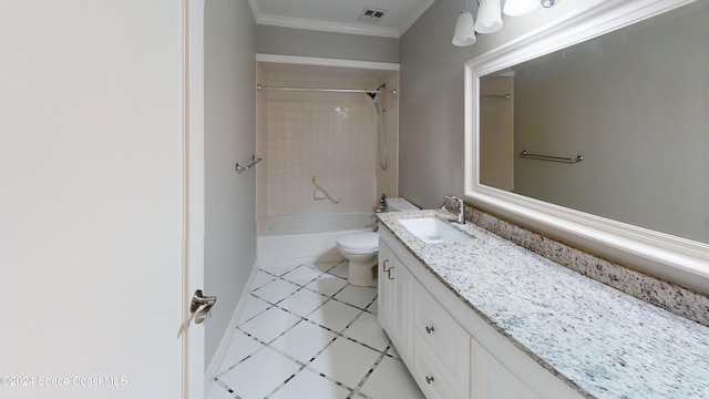 full bathroom with tiled shower / bath, toilet, vanity, crown molding, and tile patterned flooring