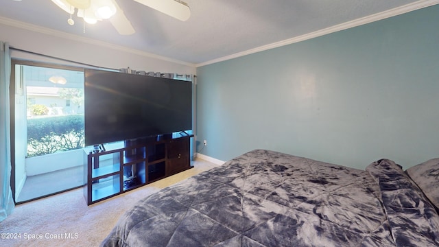 bedroom featuring ceiling fan, ornamental molding, and carpet floors