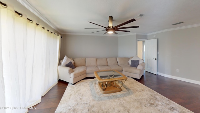 living room with ornamental molding, ceiling fan, and dark hardwood / wood-style flooring