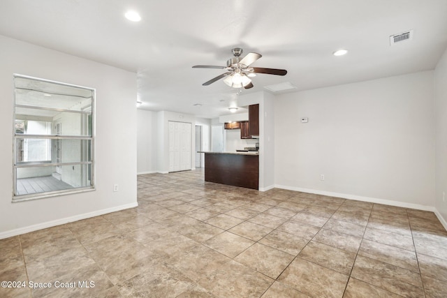 unfurnished living room with ceiling fan, baseboards, recessed lighting, and light tile patterned flooring
