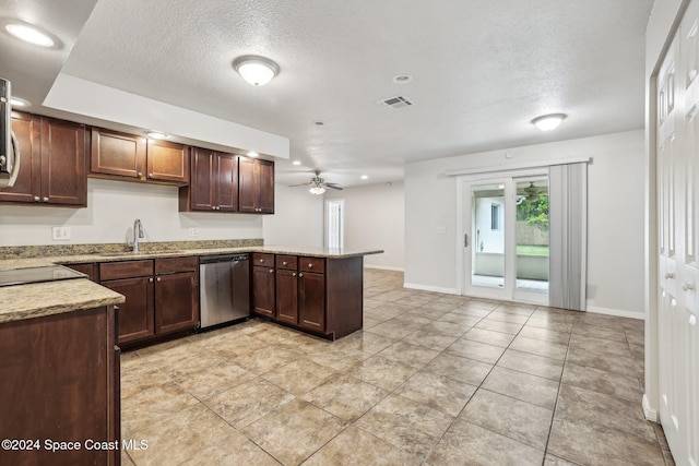 kitchen with dishwasher, a ceiling fan, a peninsula, a textured ceiling, and a sink