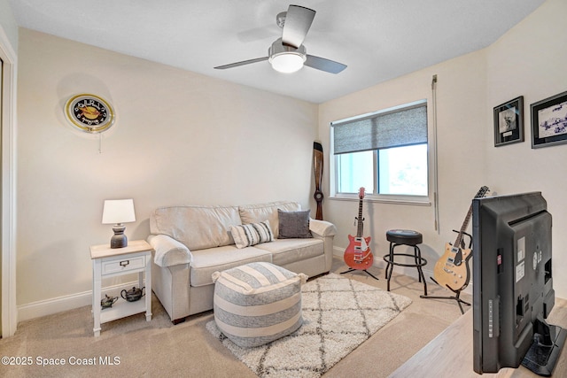 living room with light colored carpet and ceiling fan