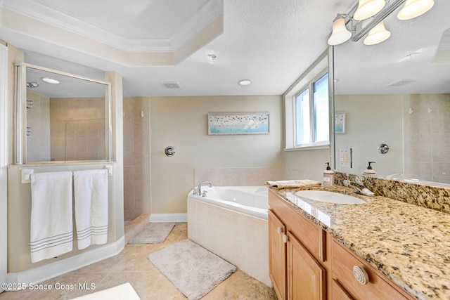 bathroom with ornamental molding, vanity, a raised ceiling, separate shower and tub, and tile patterned flooring