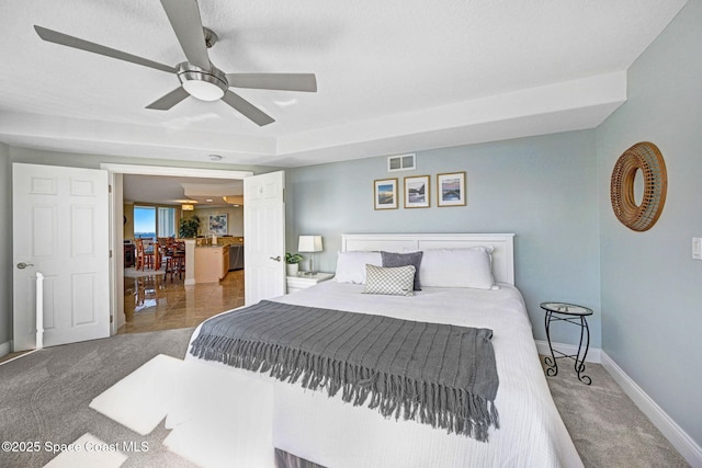 bedroom with ceiling fan and carpet floors