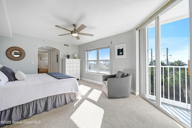 carpeted bedroom with ceiling fan and access to outside