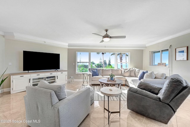 living room featuring plenty of natural light, ceiling fan, light tile patterned flooring, and crown molding