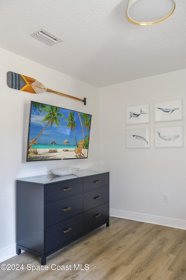 unfurnished bedroom featuring light hardwood / wood-style floors