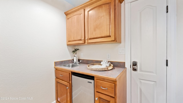 kitchen with stainless steel refrigerator and sink