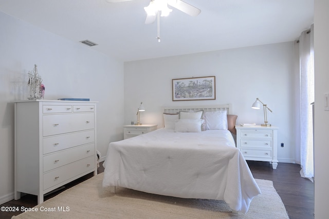 bedroom featuring ceiling fan and dark wood-type flooring