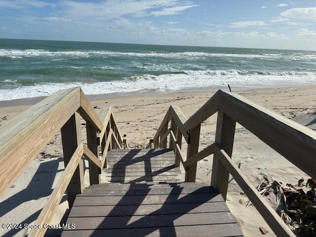 exterior space featuring a beach view