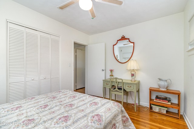 bedroom featuring a closet, ceiling fan, and wood-type flooring