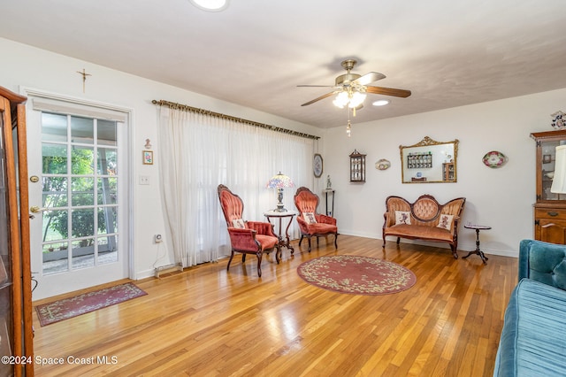 sitting room featuring light hardwood / wood-style floors and ceiling fan