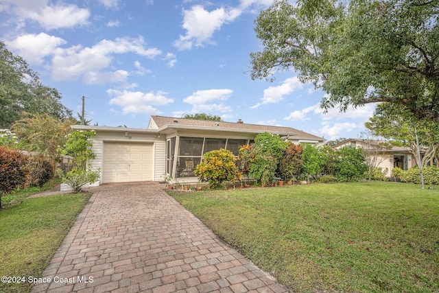 single story home with a front lawn and a garage