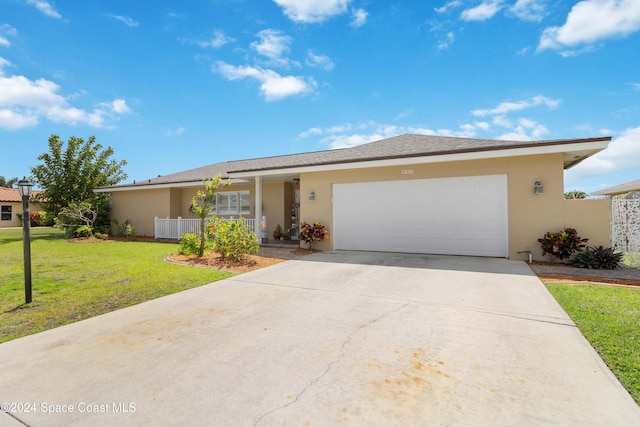 view of front facade with a garage and a front lawn