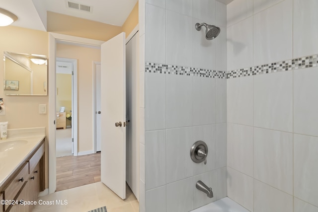 bathroom with vanity and hardwood / wood-style flooring