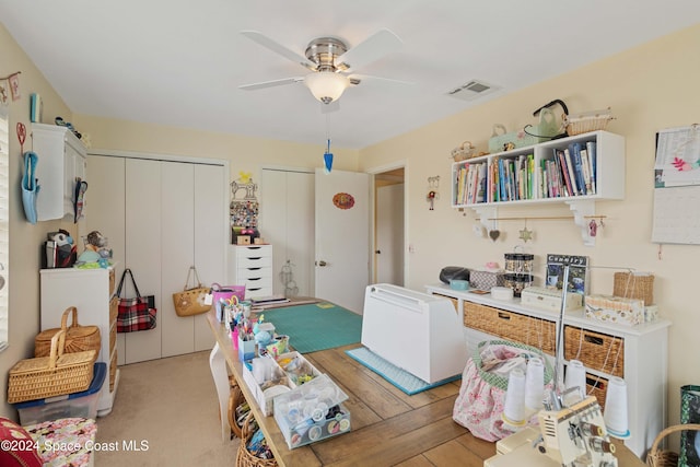 interior space with light hardwood / wood-style floors and ceiling fan