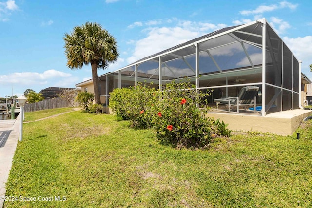 view of yard with a patio and a lanai