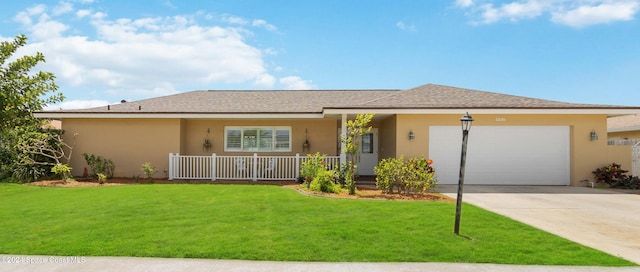 ranch-style house with covered porch, a front yard, and a garage