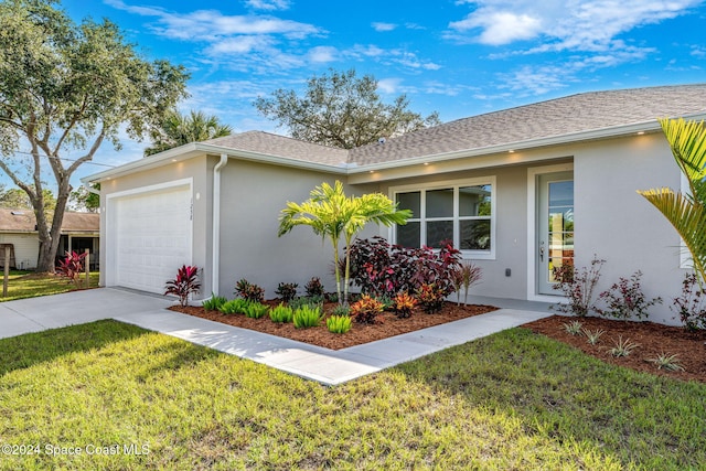 view of property exterior featuring a yard and a garage