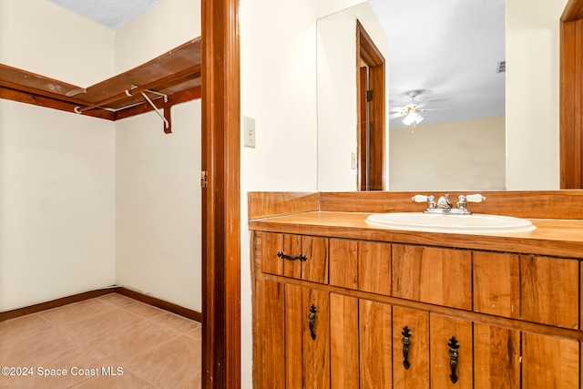 bathroom featuring vanity, ceiling fan, and tile patterned floors