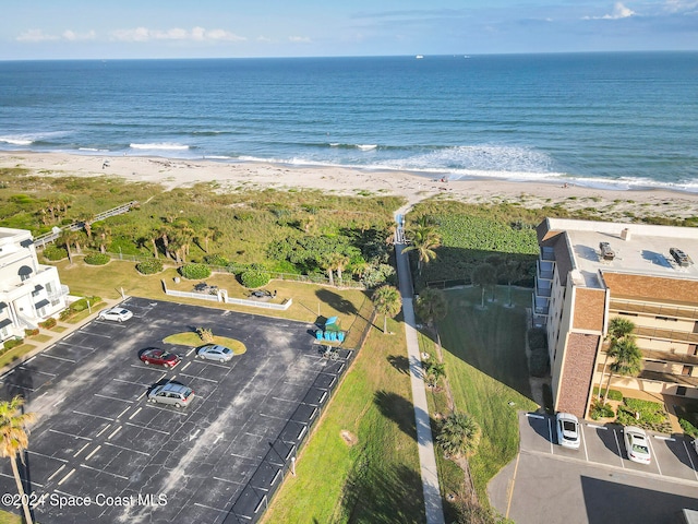 birds eye view of property featuring a view of the beach and a water view