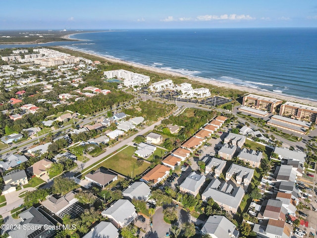 bird's eye view featuring a beach view and a water view