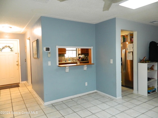 interior space with light tile patterned flooring